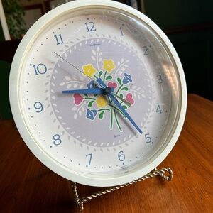 Elegant Floral Wall Clock with Blue and White Accents